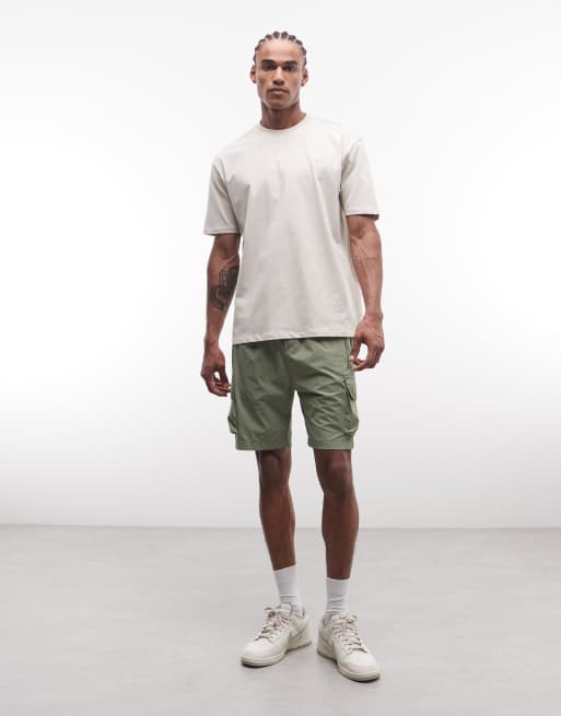 CAPO – T-Shirt in Beige mit „International“-Logoprint auf dem Rücken, 4 von 5