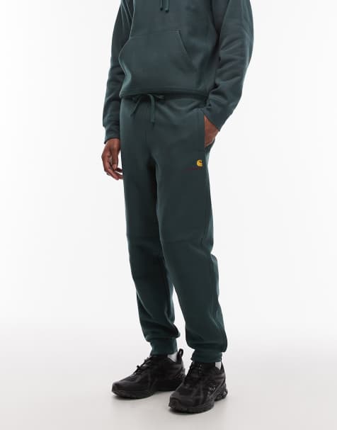 Carhartt WIP amercian script cuffed joggers in dark green