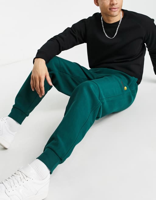 Carhartt WIP – American Script – Jogginghose in Grün