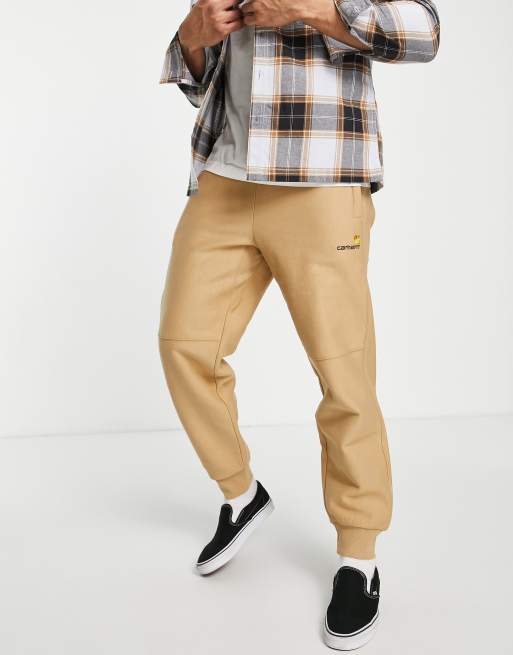 Carhartt WIP American script trackies in brown