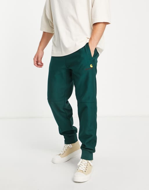 Carhartt WIP american script trackies in green