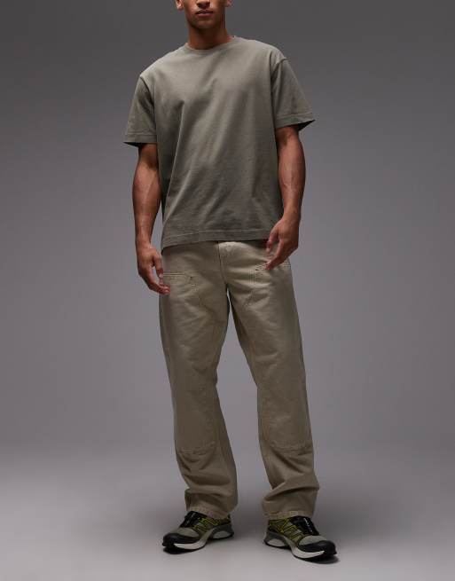 Carhartt WIP – Beżowe jeansy o luźnym kroju ze wzmocnionymi kolanami