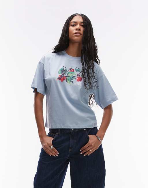 Carhartt WIP - Blå T-shirt med korte ærmer og 'Cream of the Crop'-motiv