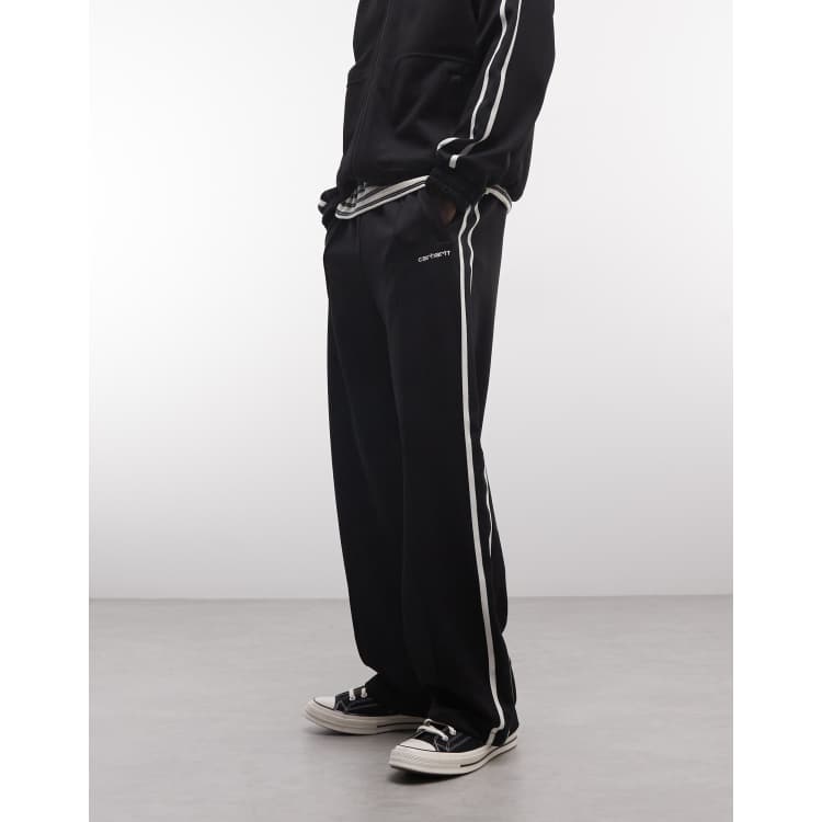 Carhartt WIP bolar sweat pants co-ord in black with side stripe | ASOS