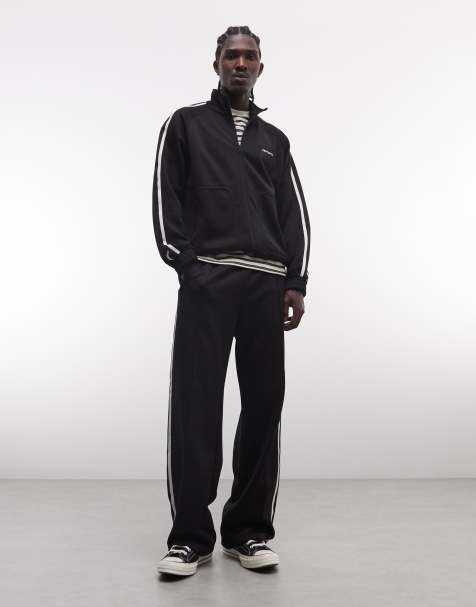 Carhartt WIP bolar tracksuit co-ord in black with side stripe - view 1