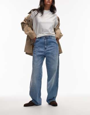Carhartt WIP - Brandon - Lockere Jeans in verwaschenem Blue Burst mit einlagiger Kniepartie-Blau