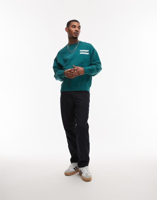 【carhartt】\"Catalogue Sweatshirt\"ロゴスウェットシャツ/green Carhartt WIP catalogue graphic sweatshirt in green | ASOS