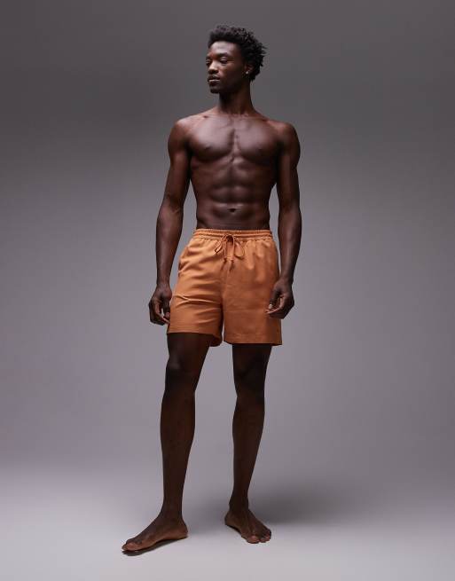 Carhartt WIP – Chase – Badeshorts in Orange, 4 von 4