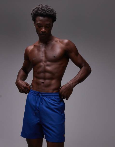Carhartt WIP – Chase – Blaue Badeshorts - view 1