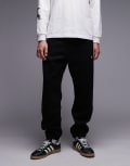 [Carhartt WIP] Carhartt WIP Chase sweatpants in black W31-32 Black