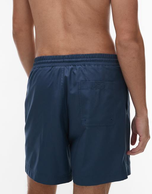 Carhartt WIP chase swim trunks in dark blue | ASOS