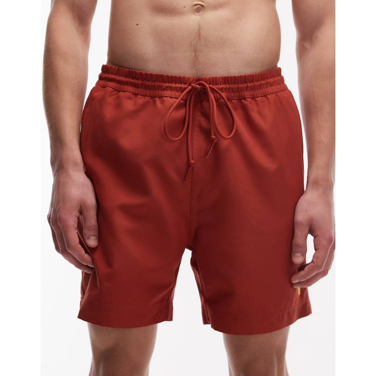 Carhartt WIP chase swim trunks in rust | ASOS