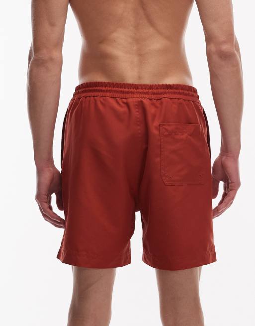 Carhartt WIP chase swim trunks in rust, 5 of 5