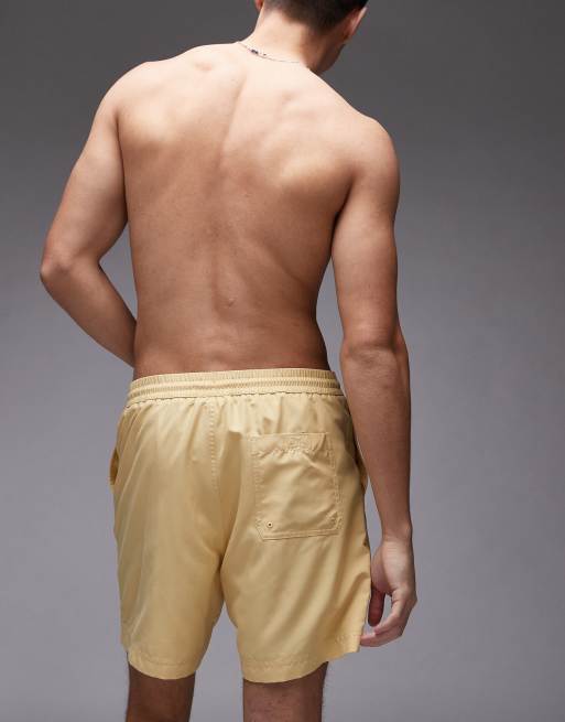 Carhartt WIP chase swim trunks in yellow, 3 of 4
