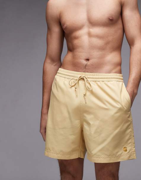 Carhartt WIP chase swim trunks in yellow