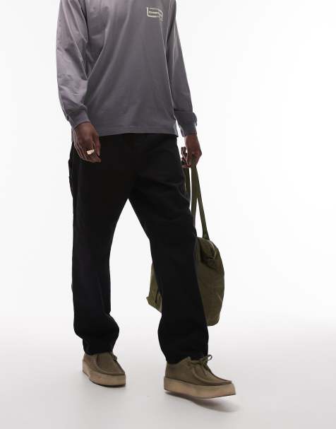 Carhartt WIP flint regular tapered fit trousers in black - view 1