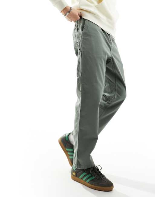 Carhartt WIP – Flint – Schmal zulaufende Hose in Grün mit normalem Schnitt