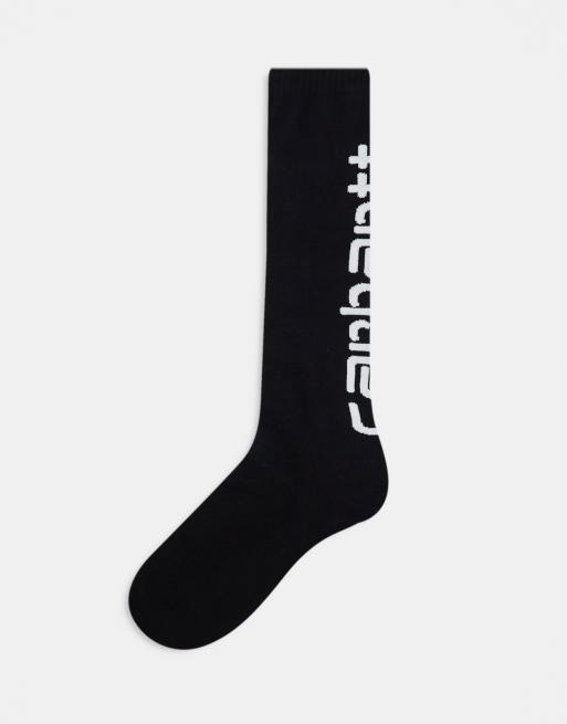Carhartt WIP – Lange Socken in Schwarz mit Schriftzug