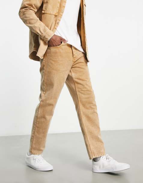 Carhartt WIP - Newel - Ruimvallende smaltoelopende jeans in bruin met stonewash - view 1