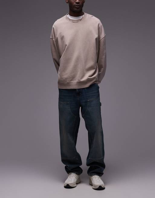 Carhartt WIP – – Niebieskie jeansy ze wstawkami na kolanach z efektem sprania w stylu vintage 