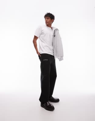 Carhartt WIP - OG - Hose in Schwarz mit Print und einfacher Stofflage im Kniebereich