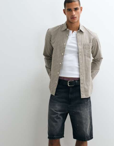 Carhartt WIP pantaloncini di jeans Landon loose tapered con effetto schizzi di vernice in lavaggio nero destroy - view 1