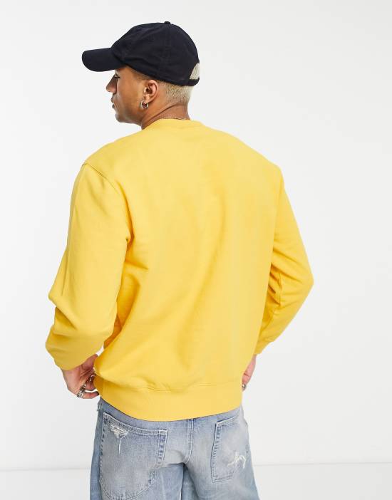 https://images.asos-media.com/products/carhartt-wip-pocket-sweatshirt-in-yellow/202135856-2?$n_550w$&wid=550&fit=constrain