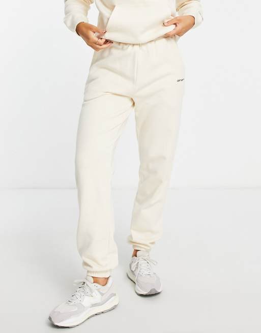 Carhartt WIP relaxed trackies with small logo in cream (part of a set)