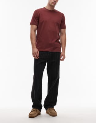 Carhartt WIP - Rylan - Schmal zulaufende, locker sitzende Jeans in Schwarz mit Streifen