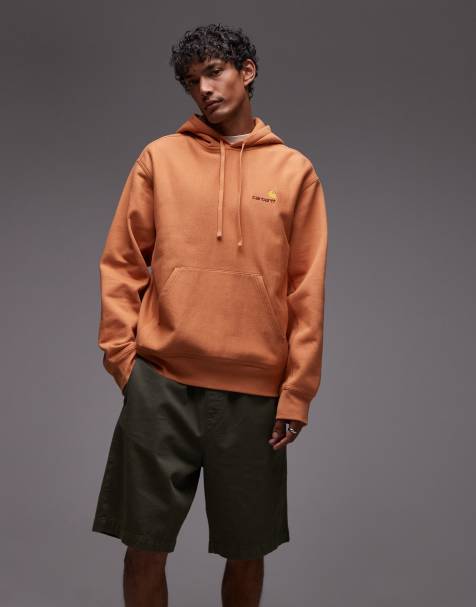 Carhartt WIP – Schwerer Kapuzenpullover in Orange mit amerikanischem Schriftzug - view 1