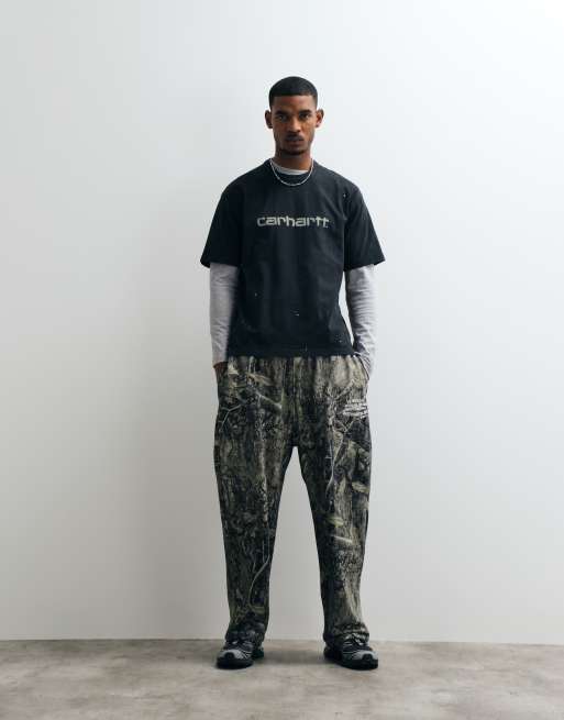 Carhartt WIP spray effect logo t-shirt with paint splatter in black, 2 of 5