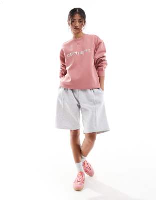 Carhartt WIP - Sweatshirt in Rosa mit Logoschriftzug-Blau