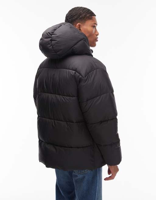 Carhartt WIP – Toronto – Svart, vattenavvisande pufferjacka med kamouflagemönstrat foder, 3 av 5