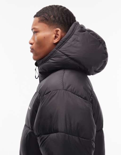 Carhartt WIP – Toronto – Svart, vattenavvisande pufferjacka med kamouflagemönstrat foder, 4 av 5