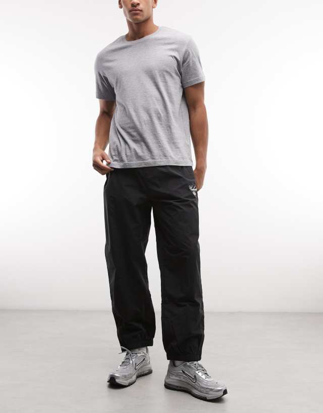 Carhartt WIP Travon relaxed fit pant in black | ASOS