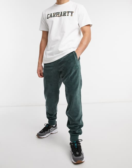 Carhartt WIP united script velour joggers in green