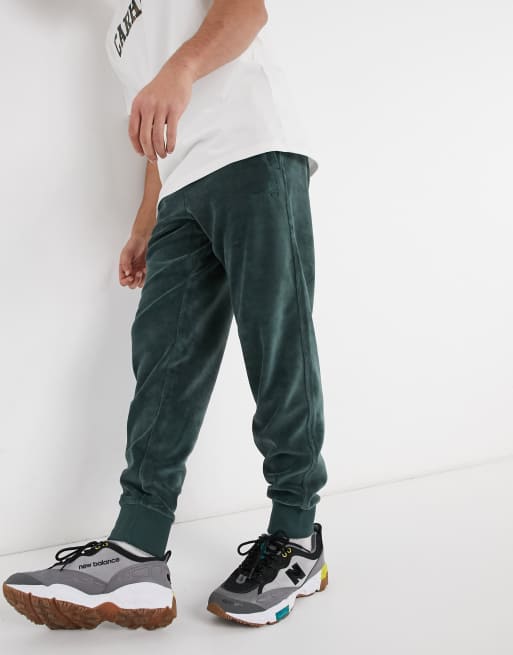 Carhartt WIP united script velour joggers in green