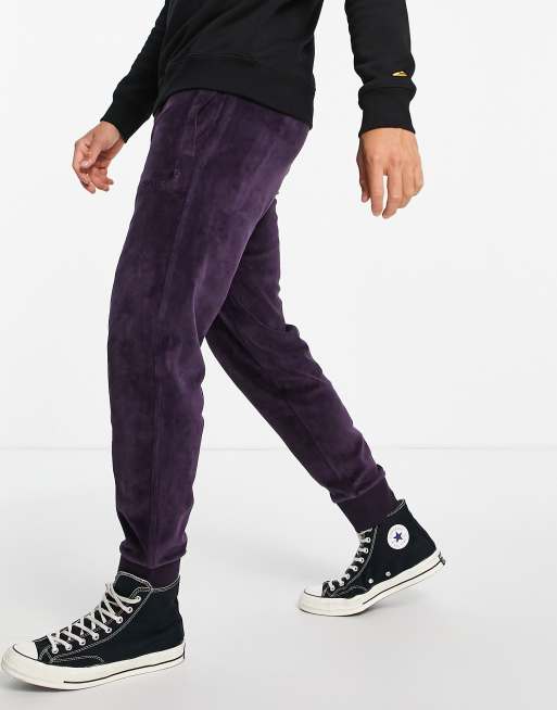 Carhartt WIP united script velvet joggers in purple ASOS