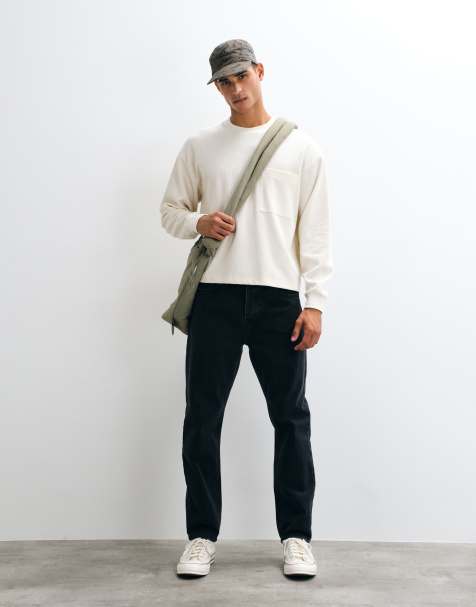 Carhartt WIP - Vaqueros Newel de corte relajado y tapered en lavado negro - view 1