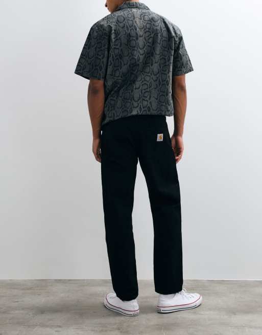 Carhartt WIP - Vaqueros Newel de corte relajado y tapered en lavado negro, 2 de 5
