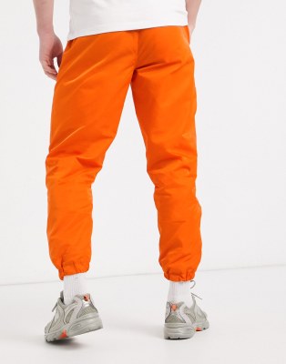 orange track pants