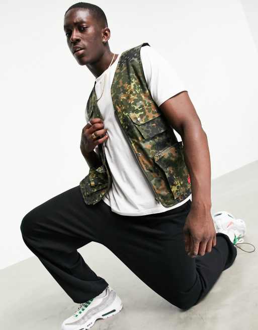 Caterpillar workwear camo print utility vest in green | ASOS