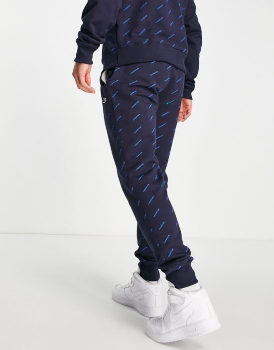 https://images.asos-media.com/products/champion-all-over-logo-print-sweatpants-in-navy/200873438-3?$n_550w$&wid=550&fit=constrain
