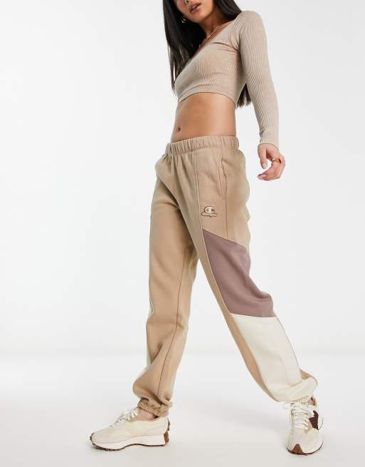 Nike mini metallic swoosh best sale oversized joggers in cream