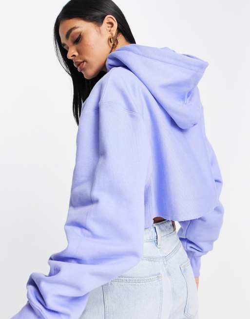 Champion cropped hoodie with small logo in blue | ASOS