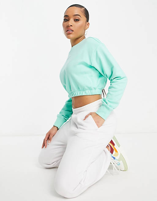 Champion cropped sweatshirt with logo in green | ASOS