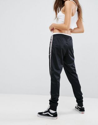 champion tracksuit bottoms with logo taping