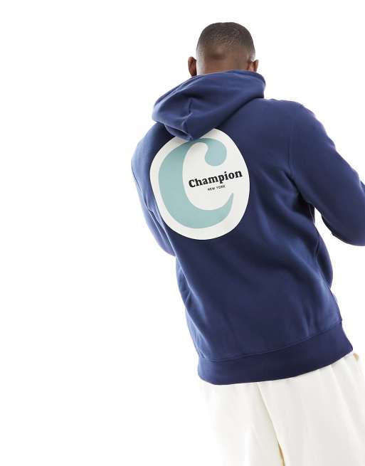 Champion Felpa color blu navy con cappuccio e stampa sul retro ASOS