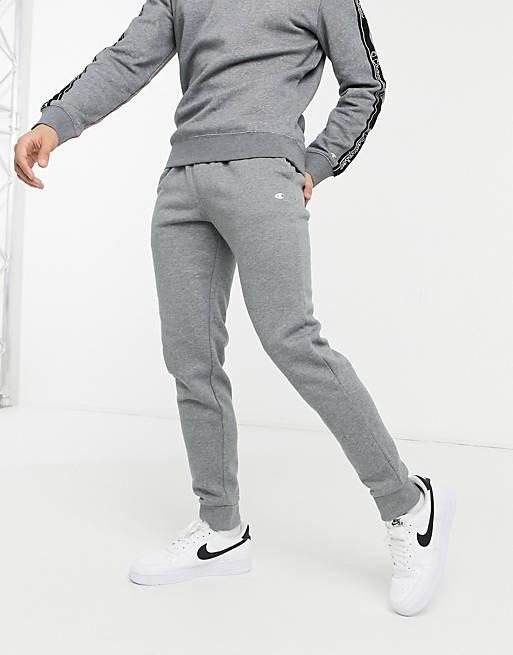 Champion - Joggers con logo piccolo e fondo elasticizzato, colore grigio