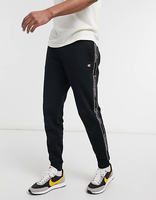 Champion – Jogginghose in Schwarz mit großem Logo und Zierstreifen | ASOS
